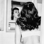 Bettie-Page-applying-her-makeup-1950s