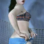 Betty Page in bikini beside a net