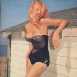 Eve Meyer in black at the beach