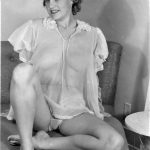 Ann Peters sitting waiting in her nightie