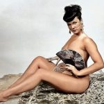Bettie is nude behind those fans